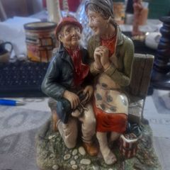 Vintage 1972 Naturecraft Stoneware Figurine, Titled Celebration, depicting an elderly couple sitting on a bench
