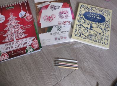 Paper cutting kit and reference book