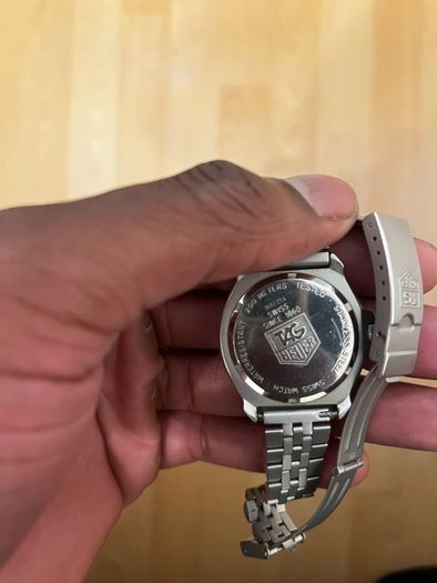 TAG HEUER WRIST WATCH, black dial with date, stainless steel bracelet strap, case ca. 34 mm