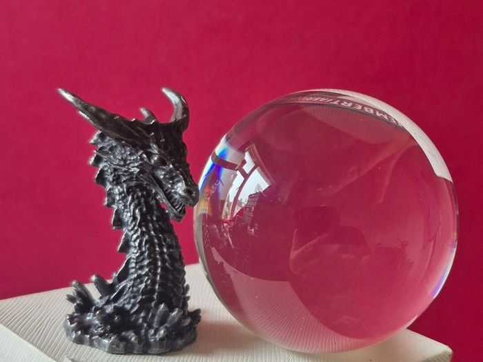 Crystal/glass ball and metal dragon stand.