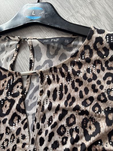 ladies top  shiny design all through it