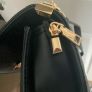 Black quilted flap shoulder bag with gold hardware Image 8