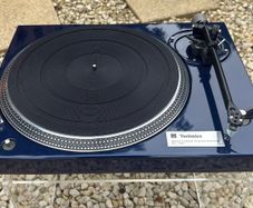 Legendary Technics SL-150 direct-drive turntable professionally repainted in stunning metallic blue and carrying a heralded Rega RB350 tonearm with a Mitchell TechnoWeight upgrade. Absolutely premium top drawer turntable performance.