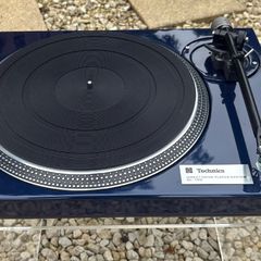 Legendary Technics SL-150 direct-drive turntable professionally repainted in stunning metallic blue and carrying a heralded Rega RB350 tonearm with a Mitchell TechnoWeight upgrade. Absolutely premium top drawer turntable performance.