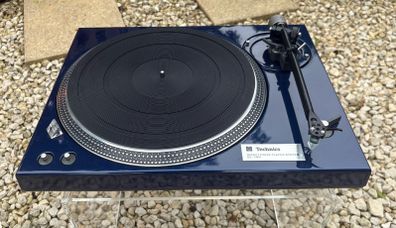 Legendary Technics SL-150 direct-drive turntable professionally repainted in stunning metallic blue and carrying a heralded Rega RB330 tonearm with a Mitchell TechnoWeight upgrade. Absolutely premium top drawer turntable performance.