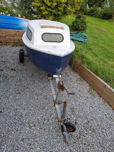 Small boat with engine and trailer