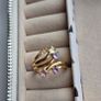The ring has a unique stacked design with several bands and beautiful pastel/coloured stones, including purple, green and champagne tones. The hallmark has worn away over time, but the ring was tested today and confirmed as genuine 14K gold weight 3.95g. Image 2