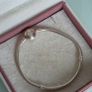 Pandora two-tone signature braceletsterling silver snake chain and a 14K gold logo clasp, size 18cm Image 4