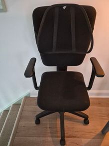 Office swivel chair on castors with back rest