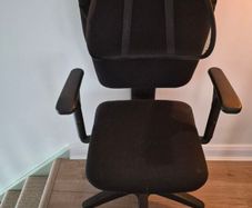 Office swivel chair on castors with back rest