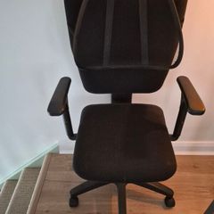 Office swivel chair on castors with back rest
