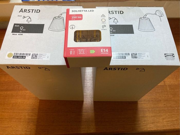 Two Ikea Astrid brass wall lights