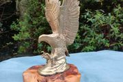 Vintage cast brass eagle on bog oak