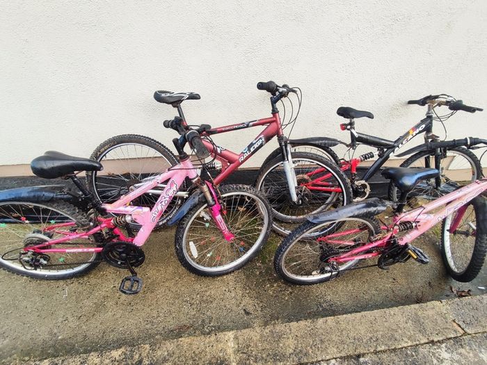 Four-bike bundle - two 24-inch Apollo and two 26-inch adult bikes
