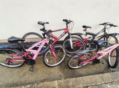 Four-bike bundle - two 24-inch Apollo and two 26-inch adult bikes