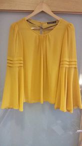 Brand new. Mustard chiffon top
