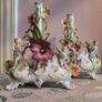 19th century pair of handpainted floral cherub porcelain candleholder/budvases Image 2