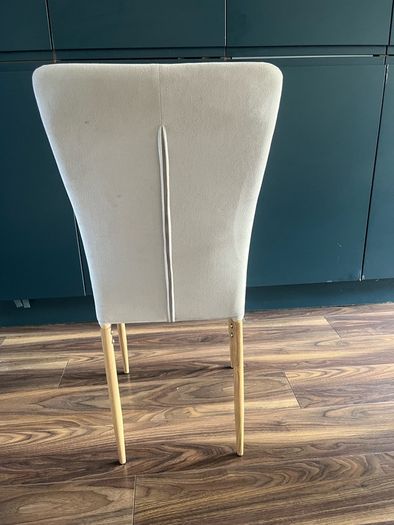 4 beige dining chairs and 2 counter stools