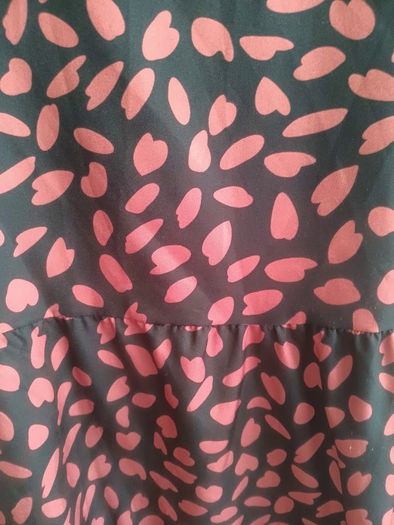 A-line tiered dress with red and black print.