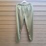 New FILA olive green athletic track pants with an elastic drawstring waistband and zippered ankle hems. Image 9
