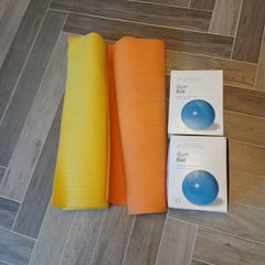 Two New Boxed Gym Balls and Two Used Yoga Mats