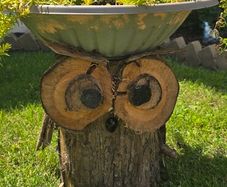 otdoor wooden flower pot stand with flowers in a pot