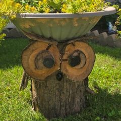 otdoor wooden flower pot stand with flowers in a pot