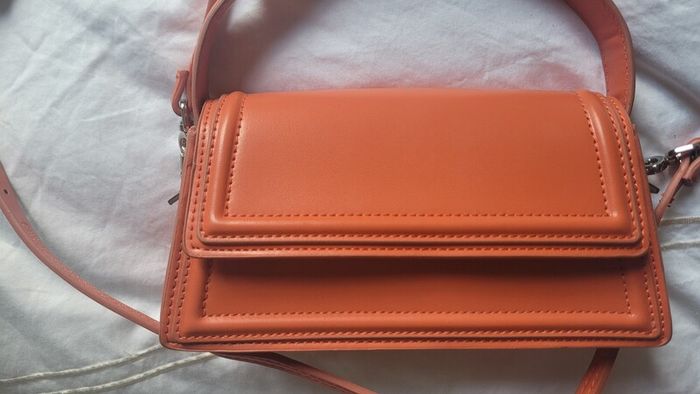 Matching orange shoes and bag