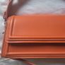 Matching orange shoes and bag Image 5
