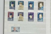 Collection. Brown stock book with collection of stamps celebrating Winston Churchill. Most are mint never hinged (MNH)