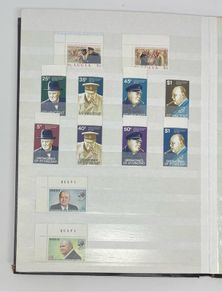 Collection. Brown stock book with collection of stamps celebrating Winston Churchill. Most are mint never hinged (MNH)