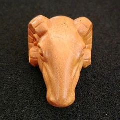 Carved wooden rams head.