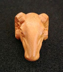 Carved wooden rams head.