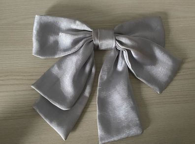 Elegant silver-grey satin hair bow barrette with French clip, gently used and in great condition