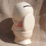A vintage novelty money box in form of a young child sitting on a toilet (1930s to 1960s) Image 3