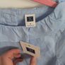 Blue top with tags Image 2