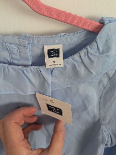 Blue top with tags