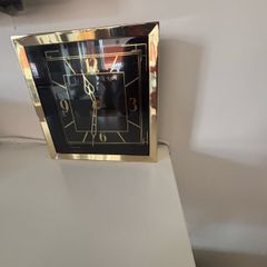 Gold clock with black face