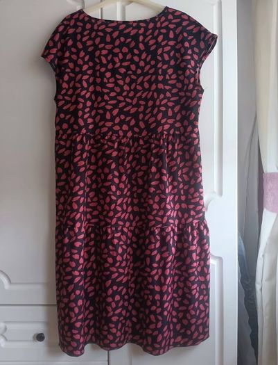 A-line tiered dress with red and black print.