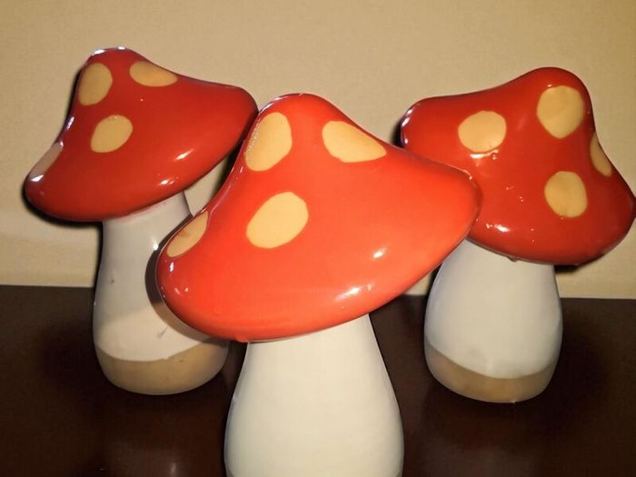 3 heavy, tall pottery mushrooms