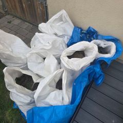 mix of grass sods, soil and stone