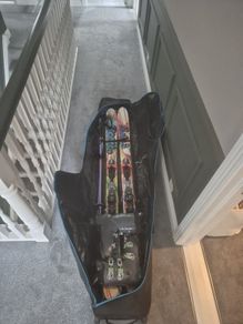skis,boots,poll,travel bag