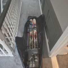 skis,boots,poll,travel bag