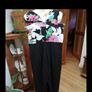Ladies Jumpsuit black with flowel detail on the top. Image 3