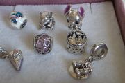 Pandora charms in great condition.Selection includes Disney Stitch (enamel &amp; figure), cute elephant, purple heart openwork, cake slice dangle, Hogwarts castle, and binoculars dangle (Good times on the horizon) 18e each charm
