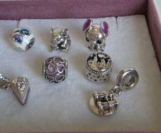 Pandora charms in great condition.Selection includes Disney Stitch (enamel & figure), cute elephant, purple heart openwork, cake slice dangle, Hogwarts castle, and binoculars dangle (Good times on the horizon) 18e each charm