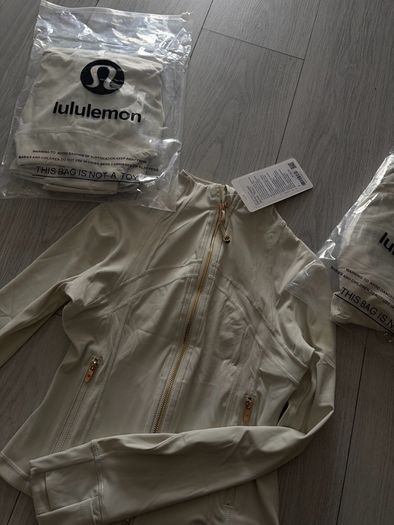 White and gold zip up