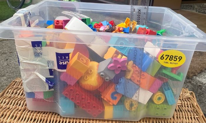 Box of Lego. 4 Figures and 4 Small Base Plates