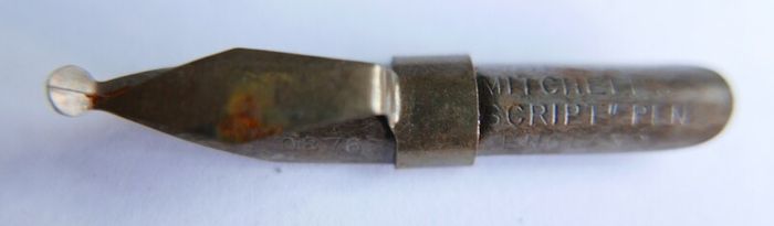 Vintage dip pen with collection of assorted nibs