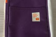 travel organizer wallet in purple with multiple card slots and mesh pockets